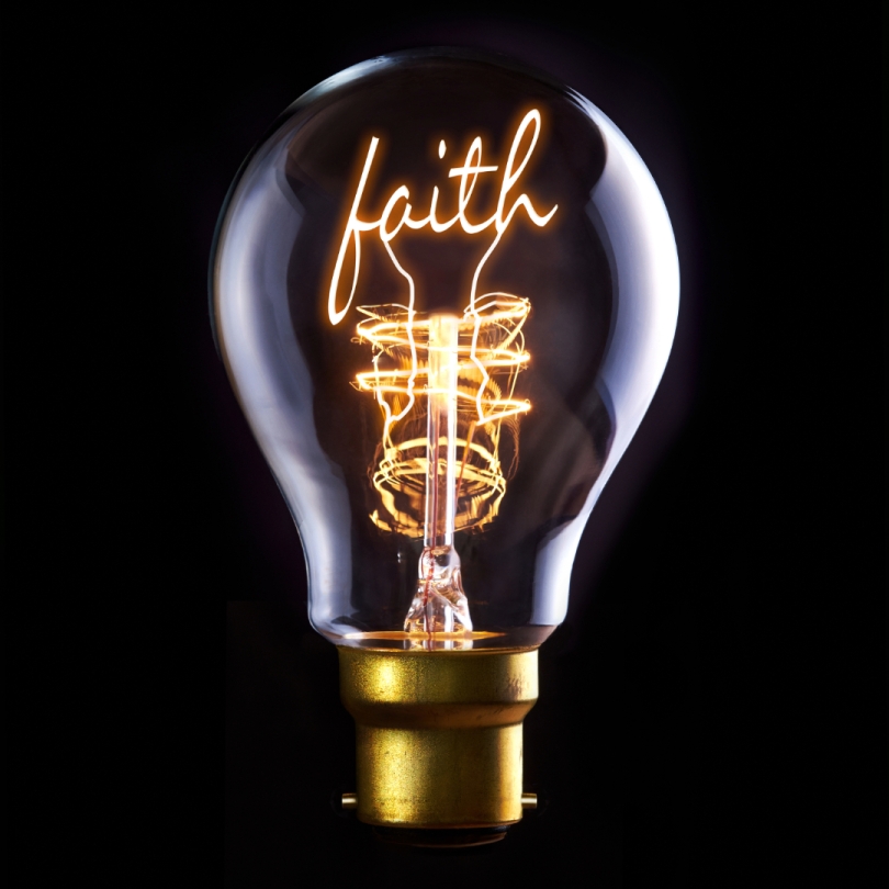 lightbulb with word "faith" inside